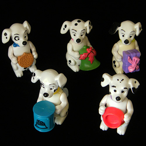 1996 101 Dalmatians — Group of standing Dogs Holding things